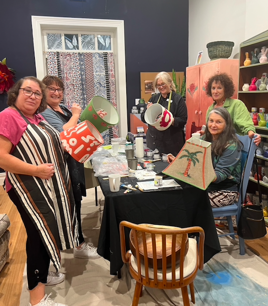 Workshop participants displaying their painted projects